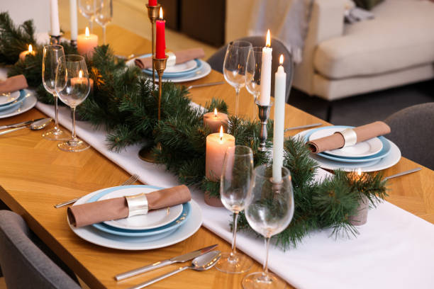 istock Festive table setting and beautiful Christmas decor in room. Interior design 1773214432