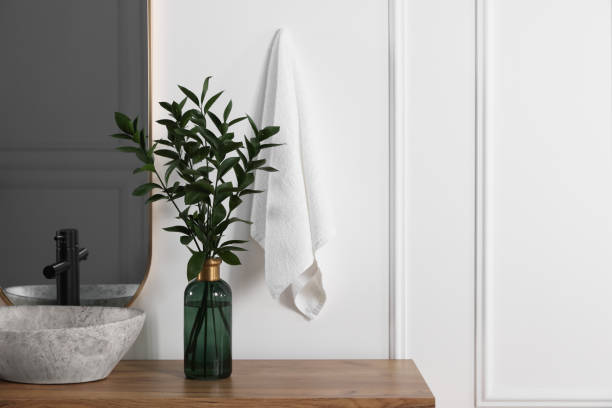 istock Stylish mirror over vessel sink and eucalyptus branches on bathroom vanity, space for text. Interior design 1773214433