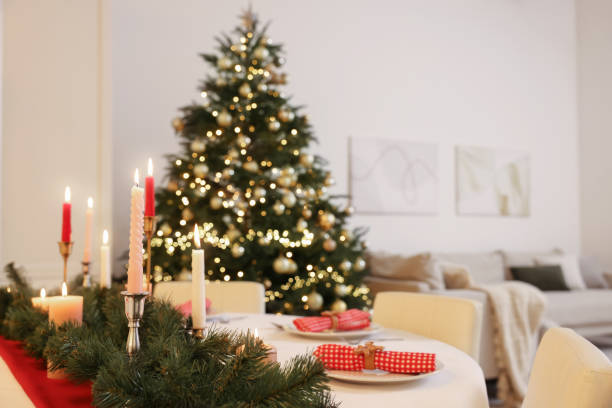 istock Festive table setting and beautiful Christmas decor in room. Interior design 1773214463