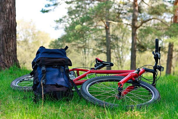 istock Bike and Backpack Lying on Green Grass 177321452