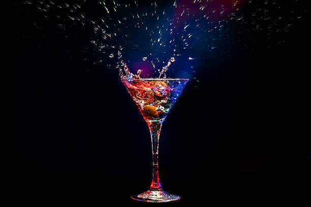 colourful coctail colourful coctail on the black backgroundcolourful coctail on the black background martini glass photos stock pictures, royalty-free photos & images