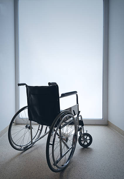空の車椅子 - disablement ストックフォトと画像