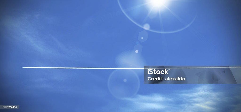 Vapour trail airoplane crossing blue sky leaving vapour trails behind it with sun shining Airplane stock illustration