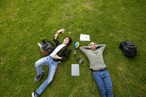 University students hanging out in campus main lawn