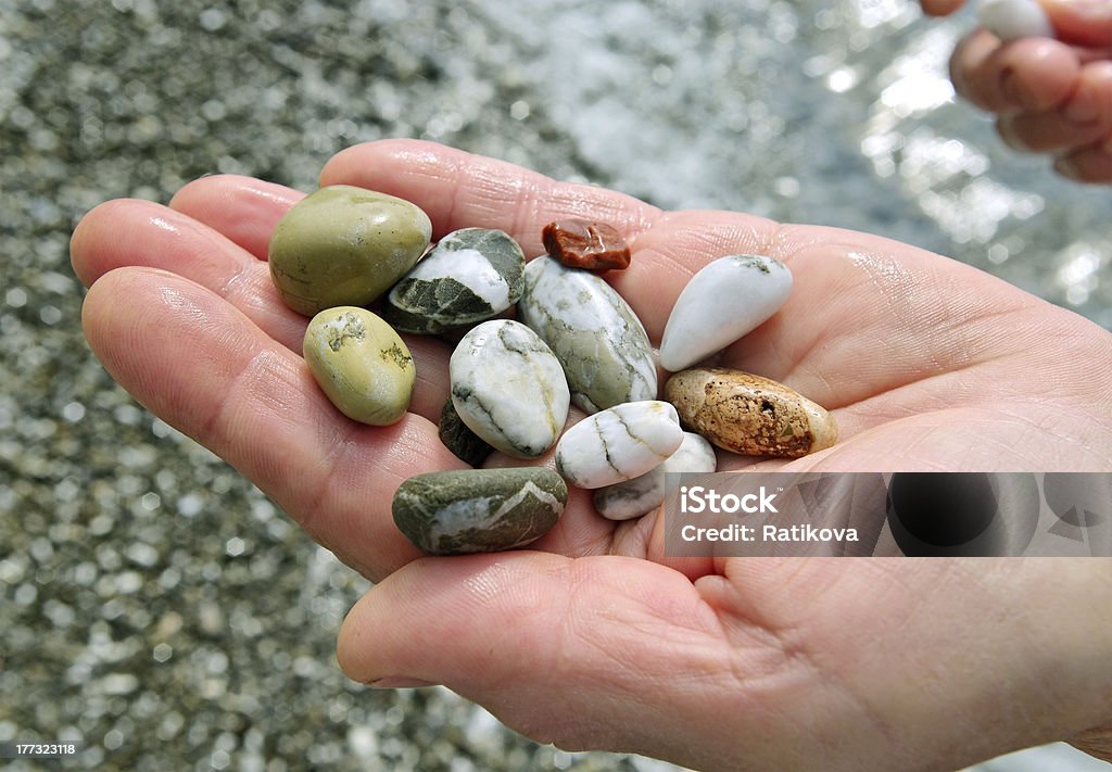 Detriti sulla mano. - Foto stock royalty-free di Acqua