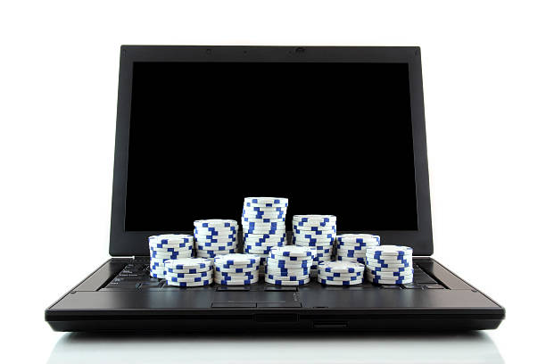 istock Laptop and white casino chips on keyboard 177323566