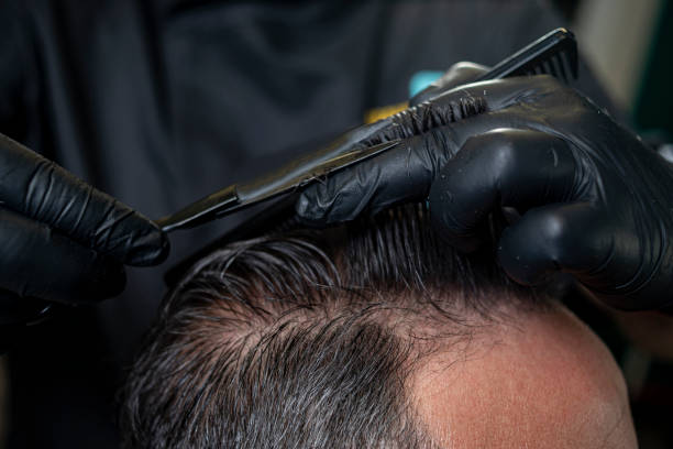 istock Barber at the haircut 1773237102