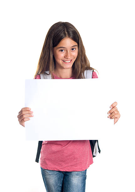 istock Schoolgirl holding blank paper 177323737
