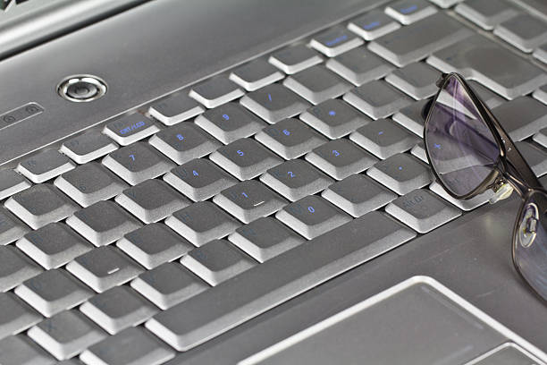 Keyboard and Glasses stock photo