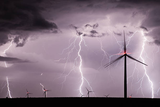 istock A thunderstorm with lightening striking wind turbines 177324068