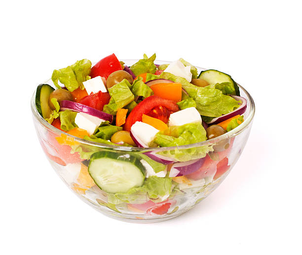 istock greek salad isolated on white 177324896