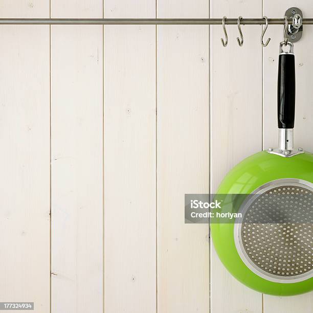 A Lime Green Frying Pan Hanging Up Stock Photo - Download Image Now - Black Color, Clean, Cooking