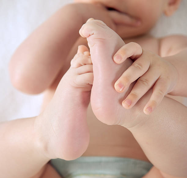 istock Baby holding his feet 177325583