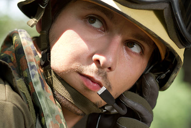 istock Soldier in helmet talking on a headset 177326148