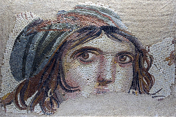 Strange drawing of woman with messy hair "This photo was taken using a tripod Museum Collection: Gaziantep Museum, This mosaic which was found during the zeugma excavations sin1992 long before Zeugma became a current issue,became the symbol of Zeugma because of the mysterious look she had in her eyes.When it could not be identified it got named aGypsyaibecause of the womenaas resemblance with gypsies.But some sources draw attention to the winein the mosaic and claim that it is GAIA the Goddess of the Earth.in Mythology it is considered that GAIA is the first element allgodaas ancestors have derived from." gaziantep province stock pictures, royalty-free photos & images