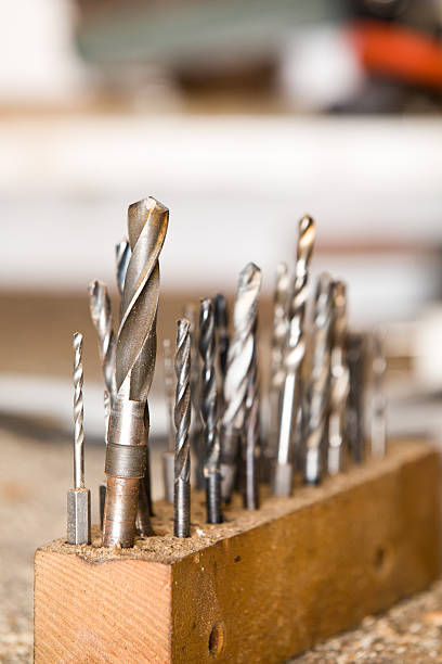 Detail of drills on workshop table, shallow focus stock photo