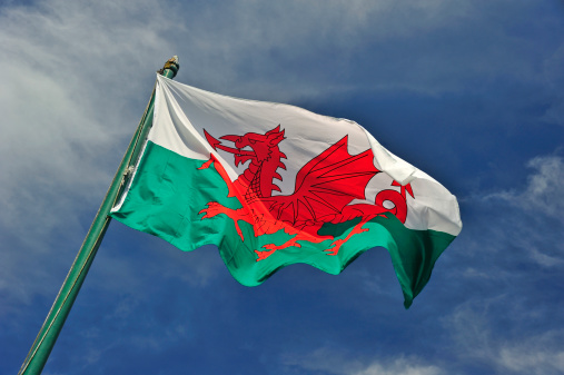 The Welsh flag against a cloudy sky