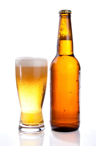 Isolated Glass and Brown bottle of beer on a white background