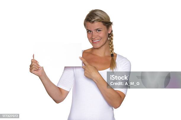 Blonde Girl Shows A Sign Plate Stock Photo - Download Image Now - Activity, Adult, Adults Only