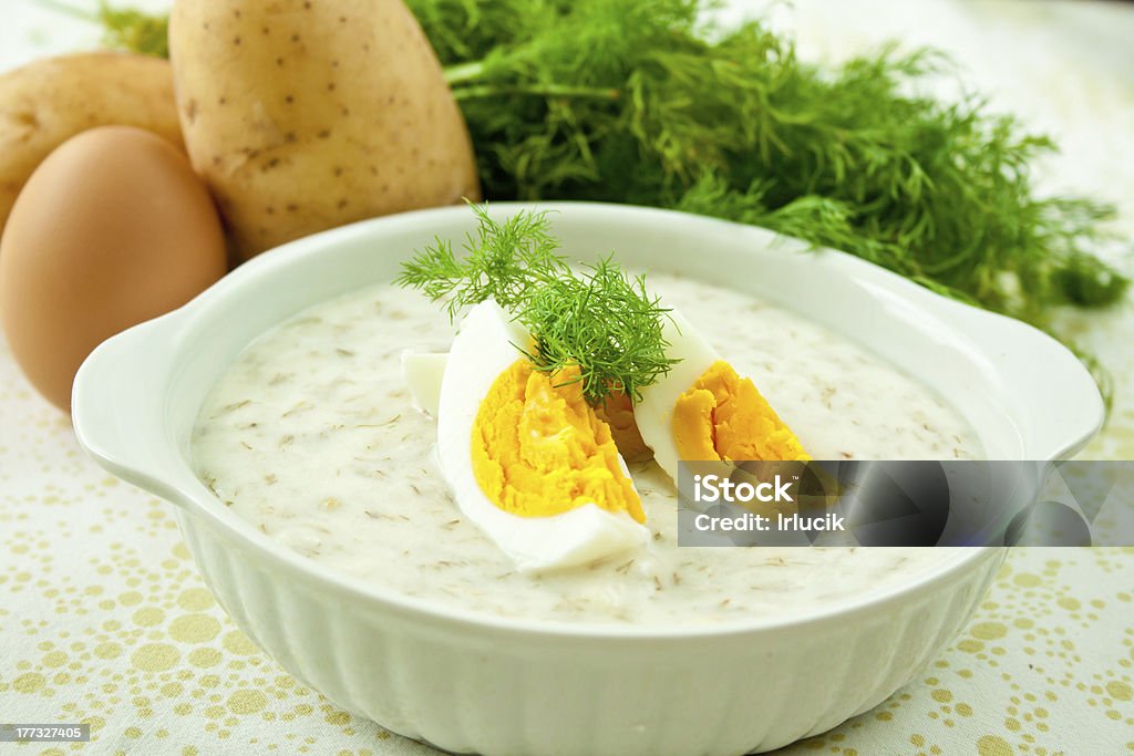 Dill soup with egg Dill soup with egg and potatoes in a white bowl. Appetizer Stock Photo