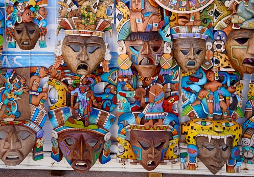 Cozumel Mexico Oct 25 2023 A display of colourful carved and painted masked in a souvenir stand representing the history and culture of the ancient Mayan Civilization