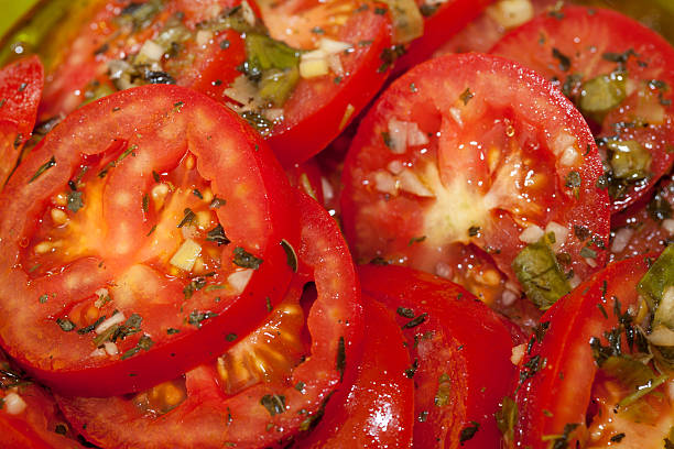 istock Marinated Sliced Red Tomatoes Closeup with Spices 177327871
