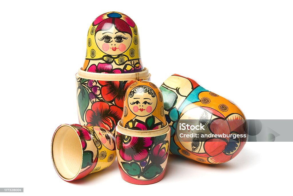 Russian Babushka or Matryoshka Dolls isolated on white background Russian Nesting Doll Stock Photo