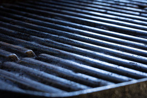 Background portraying cast iron barbecue grill grates