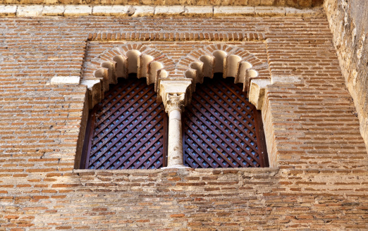 Old windows in stone wall, Valencia, Spain