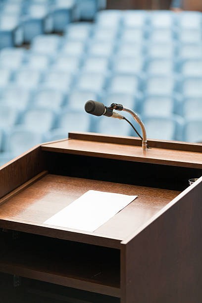 Speaker's table with paper, your text possible stock photo