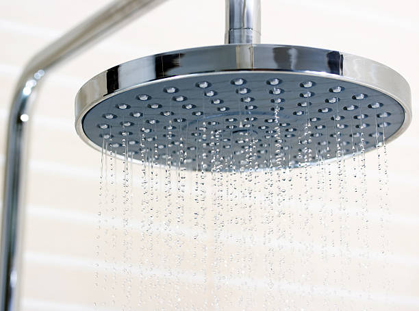 istock Closeup of shower head turned on 177329085
