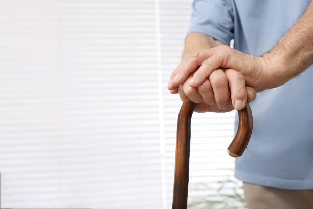 istock Senior man with walking cane at home, closeup. Space for text 1773291755