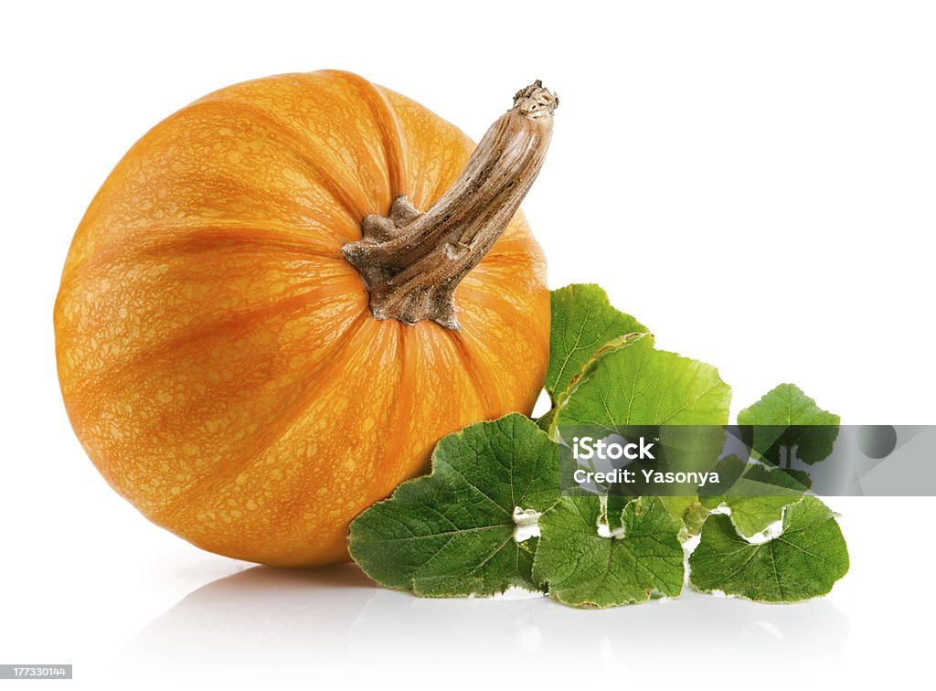 yellow pumpkin vegetable with green leaves yellow pumpkin vegetable with green leaves isolated on white background Pumpkin Stock Photo