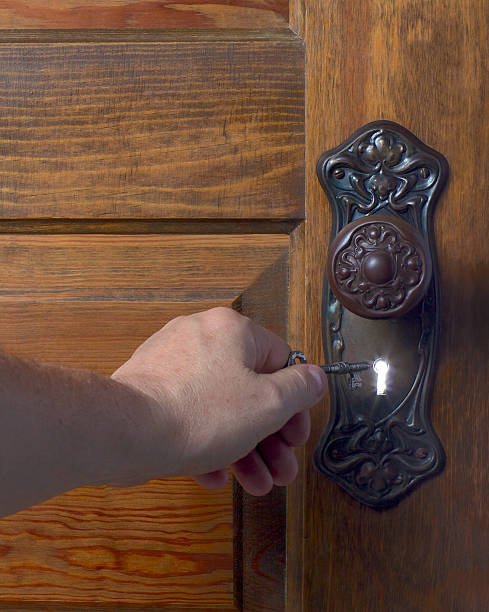 istock Old antique door and handle with an illuminated key hole. 177330267