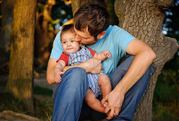 istock Father with his son in a park 177331547