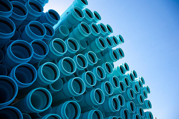 Blue PVC Pipe Stacks of blue PVC water pipes pvc stock pictures, royalty-free photos & images