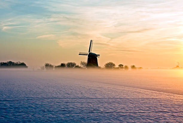 istock Traditional windmill with fog and snow in Netherlands 177335226