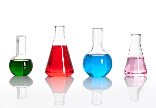 Group of laboratory flasks with a colored liqiuds "Group of laboratory flasks with a colored reagents, isolated" beaker photos stock pictures, royalty-free photos & images
