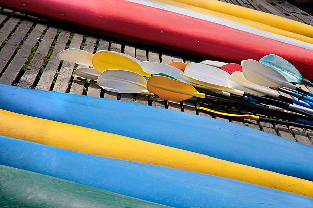 istock Reversed colorful kayaks and rowing on the shore 177336090