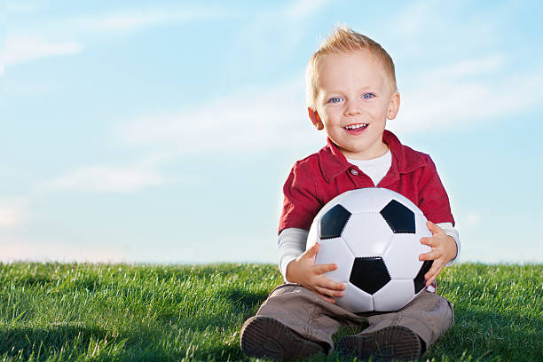 istock Cute Little Boy and his soccer ball 177336229