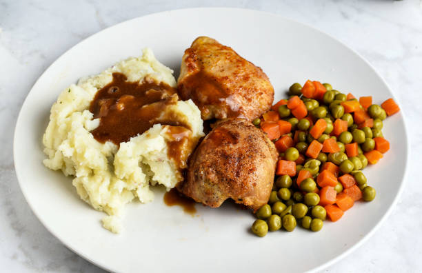 istock chicken thighs  with mash potatoes gravy and vegetables 1773363970