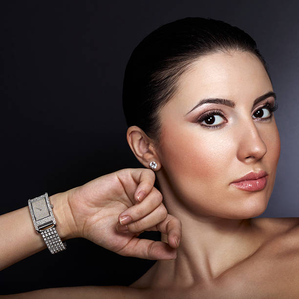 istock Beautiful woman with silver wristwatch 177336437