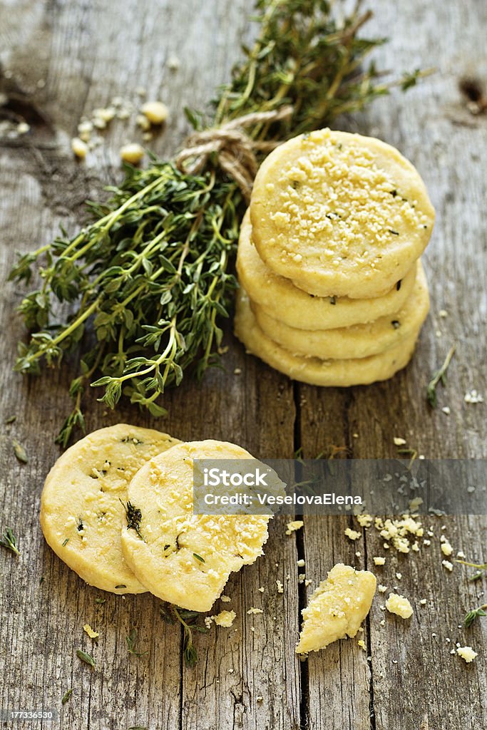 Shortbread cookies with thyme and parmesan Shortbread cookies with thyme and parmesan on a wooden table Parmesan Cheese Stock Photo