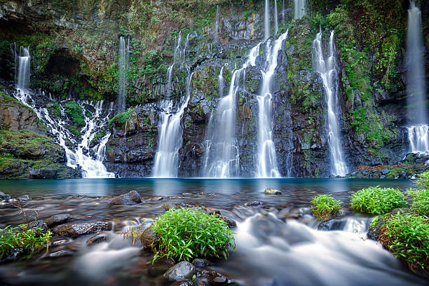 A stunning nature photograph with waterfalls  Panoramic view of waterfall on river Langevin, Reunion Island. french overseas territory stock pictures, royalty-free photos & images