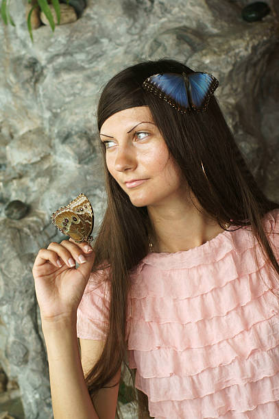 istock Beautiful young woman with a butterfly 177337308