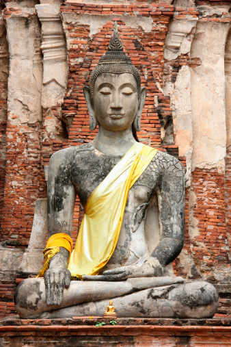 A Buddha's statue under a pagoda in Historical Park of Ayutthaya.
