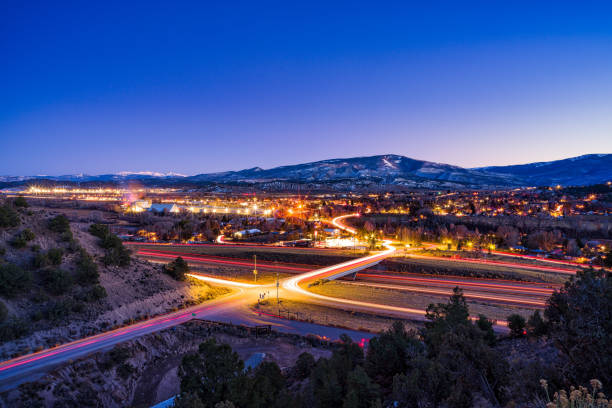 istock Dusk Blue Hour Car and City Lights Time Exposure 1773374559