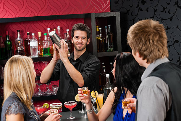 istock Barman cocktail shaker friends drinking at bar 177337555