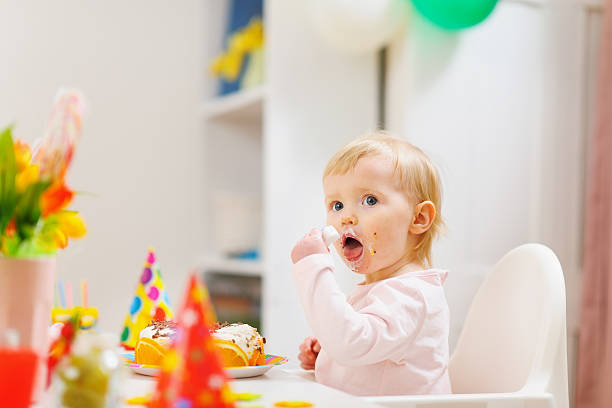 istock Eat smeared baby eating birthday cake 177337740