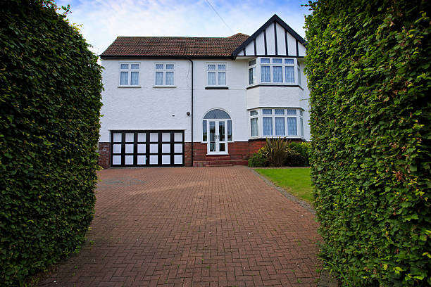 istock Typical 1930s white semi detatched house with large driveway 177338420